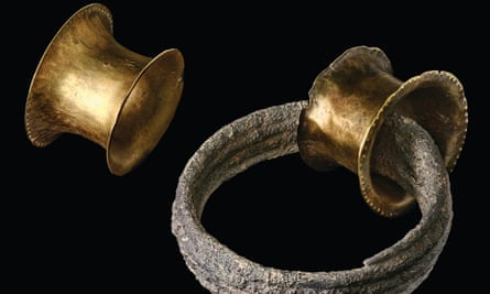 A bronze age ear plug and spiral found at La Almoloya in Murcia.