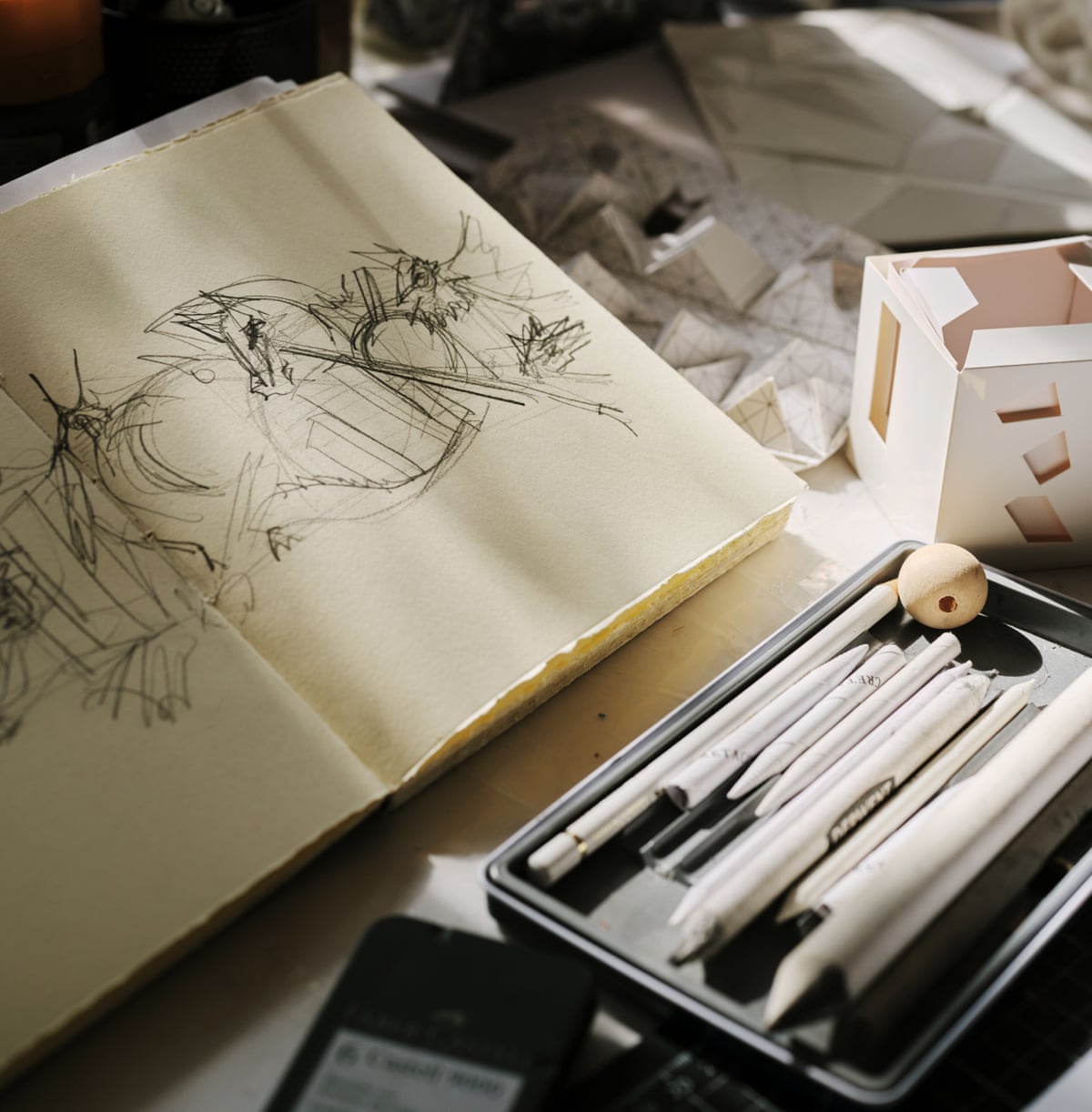 A sketchbook and pens
