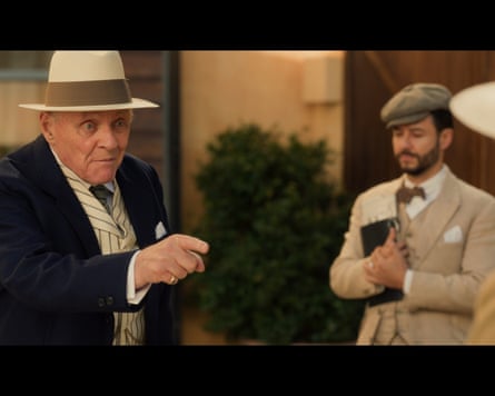 Anthony Hopkins wearing a 1930 suit and panama hat