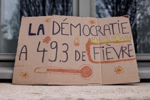 A placard reading ‘Democracy has 49.3 fever’ outside the Institute of Political Studies in Lille, which was being blocked by students protesting