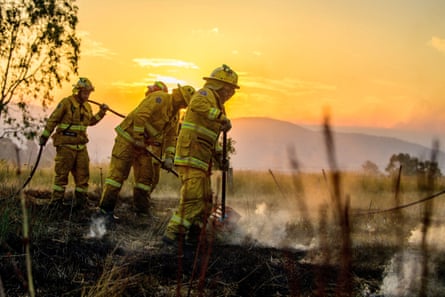 Firefighters mop up hot spots after a bushfire near the Victorian town of Alexandra