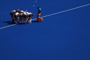 The England women’s hockey players huddle before the match against Wales.
