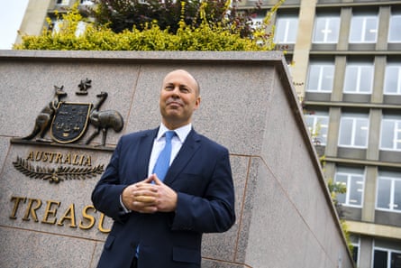 Josh Frydenberg poses for photographs outside the Treasury department building in Canberra in 2022