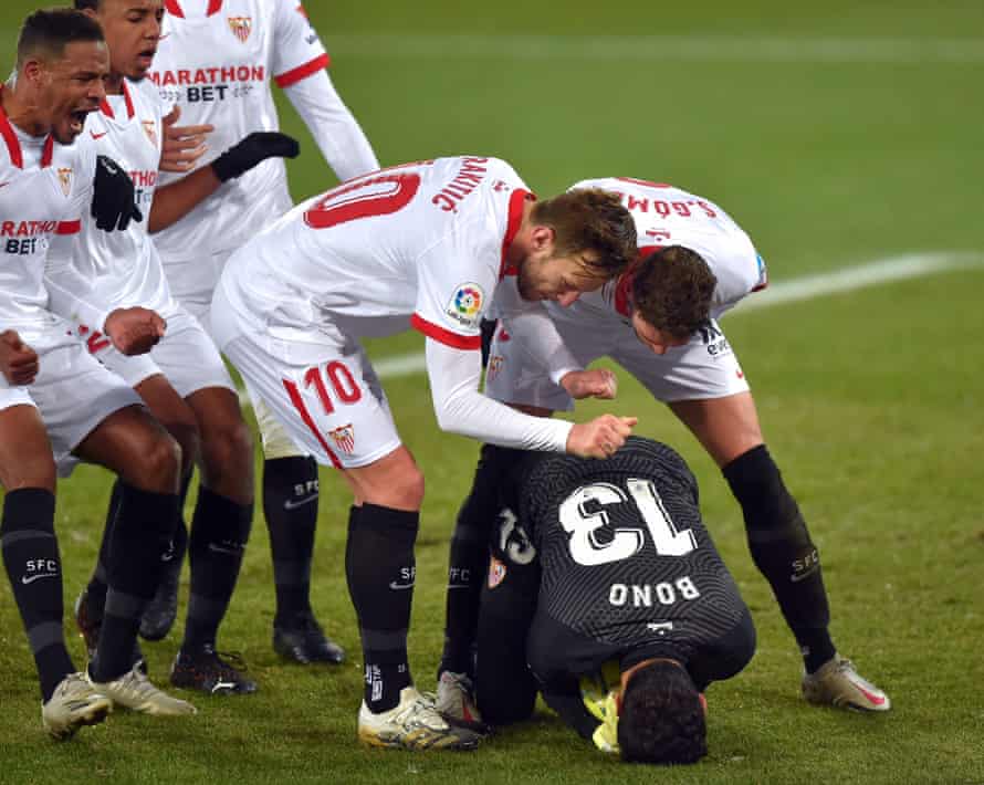 Sevilla’s players show their appreciation for Bono after his decisive penalty save.