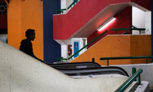An African migrant rides an escalator at the Central Bus station in Tel Aviv, October 21, 2014