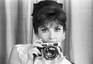 Gina Lollobrigida with her camera at her home on the ancient Appian Way on the outskirts of Rome on 2 July 1964