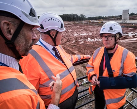 Angela Eagle, the environment secretary, with Portsmouth Water officials at the site of a new reservoir at Havant Thicket in Hampshire.