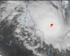 Australia news live: Tropical Cyclone Narelle forecast to hit far north Queensland three hours earlier than expected; ASX plunges amid Iran war