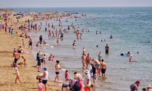 Beach goers in Devon, UK, during Aug 2018 heatwave.