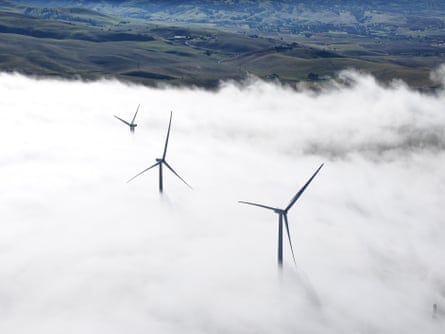 Dense fog blankets wind turbines in California.