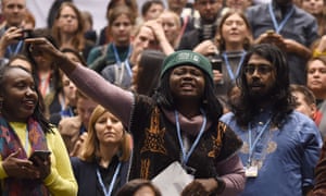 Environmental campaigners protest outside the final session of the international climate change conference in Katowice, Poland.