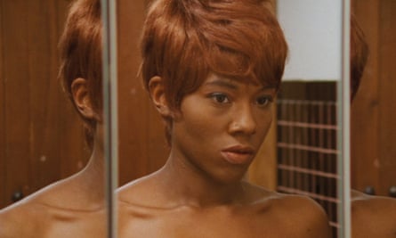 ‘As a film lover, I want more’: the Black female directors taking centre stage A woman with a pixie cut stares into a mirror, in a still from Naked Acts
