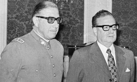 Augusto Pinochet, left, and President Salvador Allende attend a ceremony naming Pinochet as commander in chief of the army, 23 August, 1973.