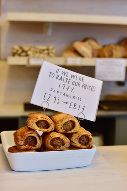 A sign showing the effect on the price of sausage rolls of a 177% increase at Two Magpies Bakery in Southwold.