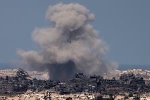 Smoke billows from a building after an Israeli strike