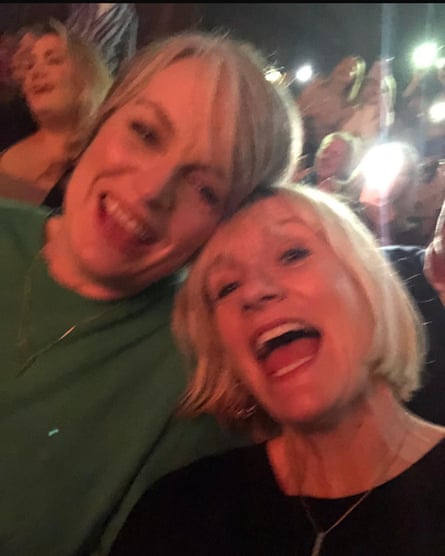 Selfie of two women with blonde hair bumping their head sideways