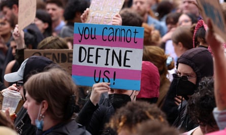 Members of the trans community gather outside the UK parliament in London during a Transgender Liberation emergency demonstration 19 April 2025.
