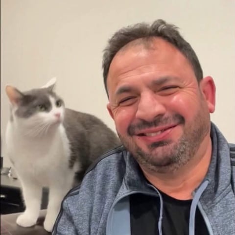 a man with a cat