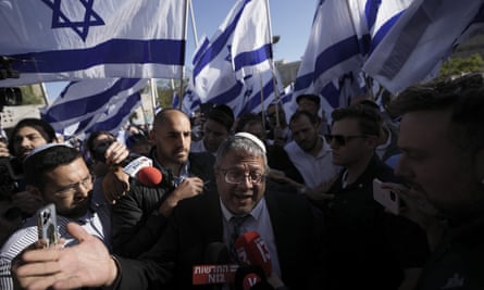 Israeli lawmaker Itamar Ben-Gvir, centre, surrounded by rightwing activists