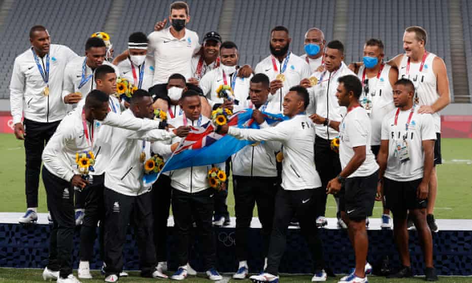 The sevens gold winners Fiji celebrate on the podium after retaining the title they won at Rio, for only the small Pacific nation’s second Olympic medal.