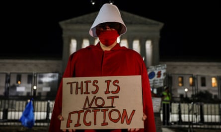 An abortion rights demonstrator in a Handmaid’s Tale costume outside the US supreme court after Roe v Wade was overturned, Washington, 24 June 2022.