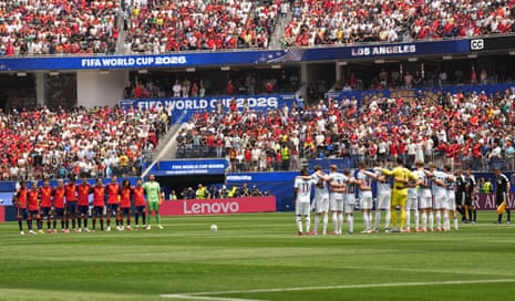 Players and spectators observe a minute of silence for the victims of the wildfires in Spain.