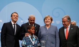 (L-R) French president, Emmanuel Macron, prime minister of Fiji, Frank Bainimarama, 12-year-old Timothy Naulusala, German chancellor, Angela Merkel and Antonio Guterres, secretary general of the UN.