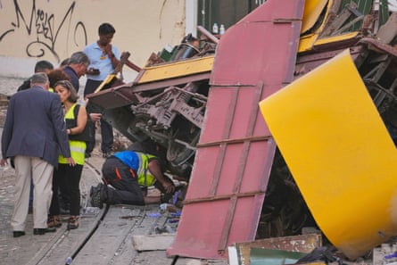 Police officers inspect the site.