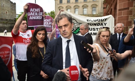 Julian Smith is surrounded by Bloody Sunday justice campaigners, Equal Marriage Rights protestors and Irish Language Act activists