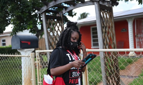 Bettylourde Guerrier canvasses a neighborhood encouraging people to vote for Joe Biden on 6 October 2020 in Miami Gardens, Florida.