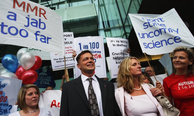 Andrew Wakefield and his then-wife Carmel in 2007, flanked by supporters ahead of an appearance before the GMC.