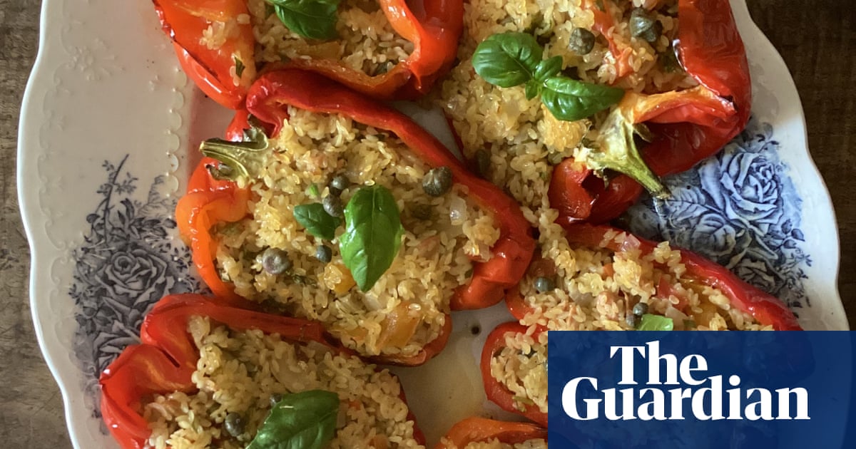 Rachel Roddy’s recipe for red peppers stuffed with orzo, tuna, capers and herbs