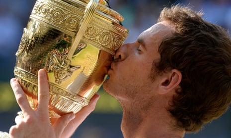 Andy Murray with the winner’s trophy at Wimbledon after beating Novak Djokovic in 2013.