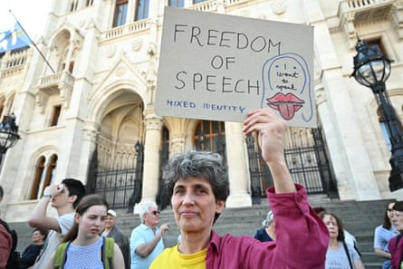 A protester holds up a placard