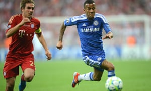 Philipp Lahm (left) battles for the ball with Ryan Bertrand (right).