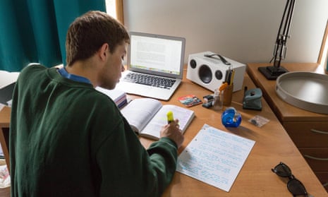 A student working at his desk.