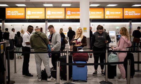 EasyJet passengers queuing to check bags at Gatwick