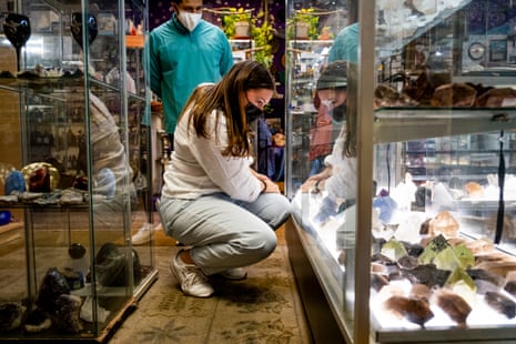 Kyiana Vargas, who’s recently become interested in crystals and metaphysical healing because of increased anxiety during the pandemic, looks at different crystals in at Herbs and Arts shop in Denver.