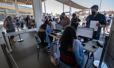 British tourists queue at Faro Airport for Covid-19 tests before flying home.