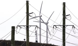 File photo of wind turbines seen behind electricity wires at the Infigen Energy wind farm located on the hills surrounding Lake George, near the Australian capital city of Canberra, Australia<br>Wind turbines can be seen behind electricity wires at the Infigen Energy wind farm located on the hills surrounding Lake George, near the Australian capital city of Canberra, Australia, in this May 13, 2013 file photo. China’s state-owned enterprises are targeting Australia’s energy sector, attracted by a privatisation push and policy U-turn, after last year’s leadership coup ushered in a warmer regulatory climate.