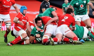 Ireland’s Quinn Roux scores their first try.