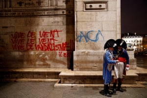 Graffiti is seen on the wall at the Arc de Triomphe the day after clashes with protesters