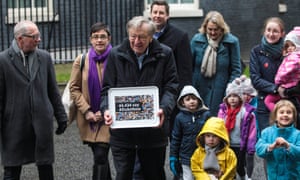 Lord Dubs and campaigners deliver the petition to 10 Downing Street