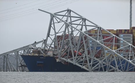 The collapsed Francis Scott Key Bridge lies on top of the container ship Dali in Baltimore, Maryland.