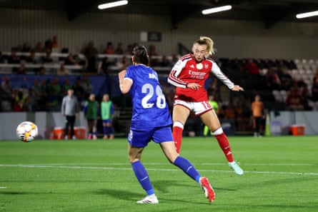 Chloe Kelly scores a goal under pressure from Simone Boye Sørensen