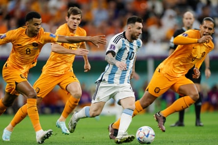 Argentina’s Lionel Messi dribbles away from three Dutch players in the 2022 World Cup. Argentina’s Lionel Messi dribbles away from three Dutch players in the 2022 World Cup.