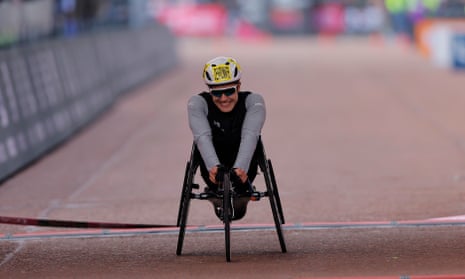 Switzerland’s Catherine Debrunner crosses the finish line to win the women’s wheelchair race!