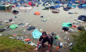 The notoriously soggy festival was badly flooded after a thunderstorm.