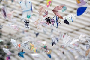 A detail from Moths to a Flame, an installation of 20,000 moths made from milk bottles sent from people all over the world, installed in Kibble palace.