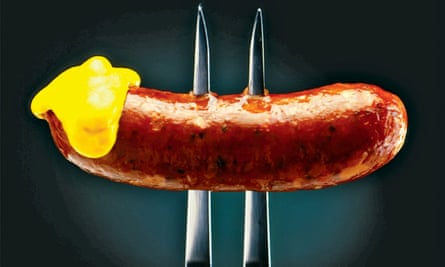 Sausage on a fork with mustard